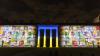 Colourful images of Ukrainian mosaics, that have been destroyed in the war, projected at nighttime onto a large rectangular building with an arch of four columns in the middle.