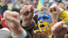 Man with face painted in colours of Ukraine flag