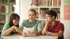 Students with teacher and tablet device