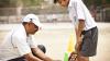Teacher in India shows student how to play cricket