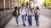 a group of university students walking on the street