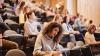 A lecture theatre full of students studying