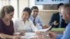 A group of people in a meeting.