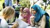 Diverse group of young learners studying outdoors