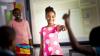A girl pointing at her classmates