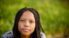 A young person looking at the camera
