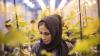 Woman studying plant specimens