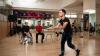 Three people a gym rehearsing for a performance